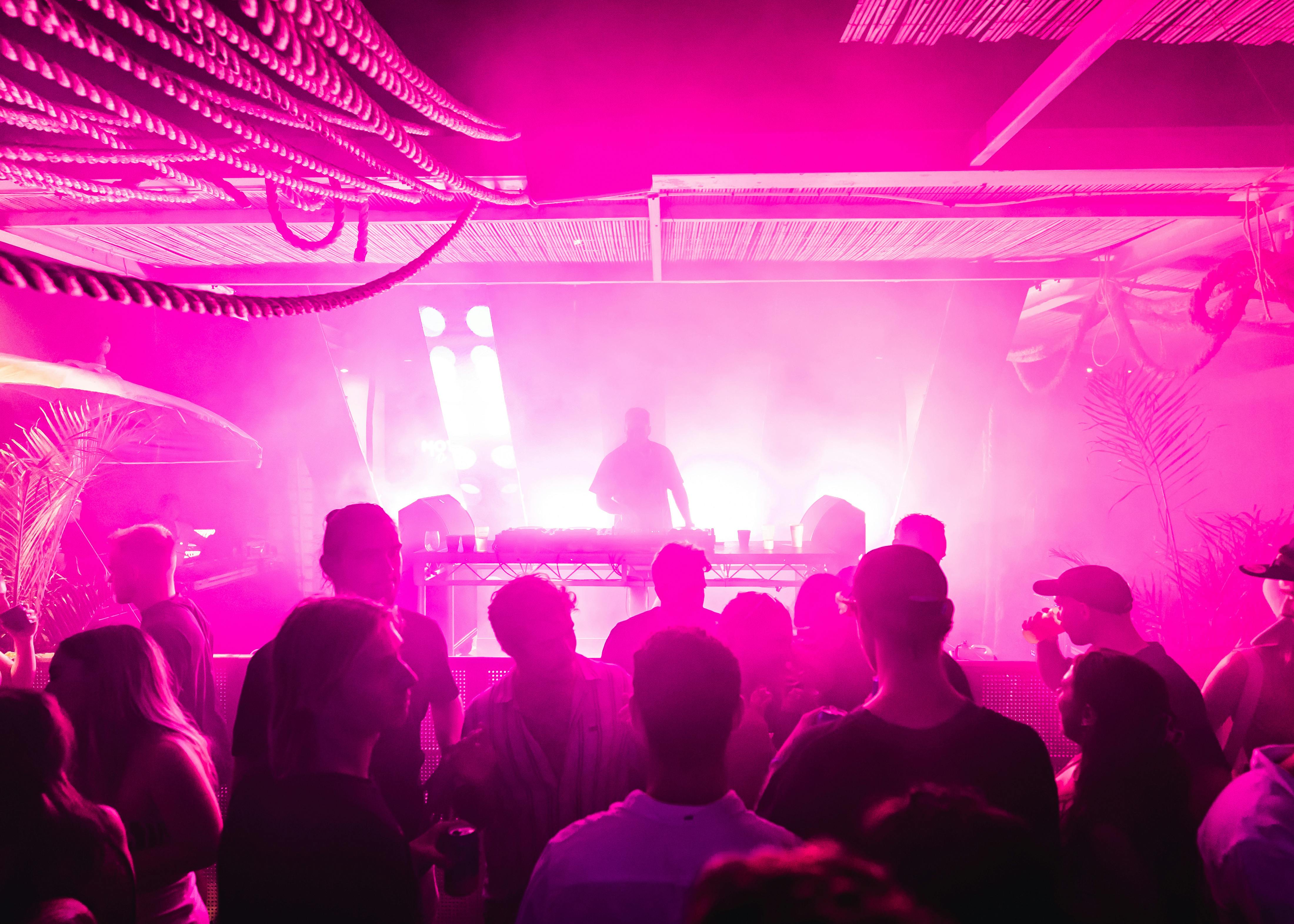 DJ performing with crowd at Pink Coffee Party event